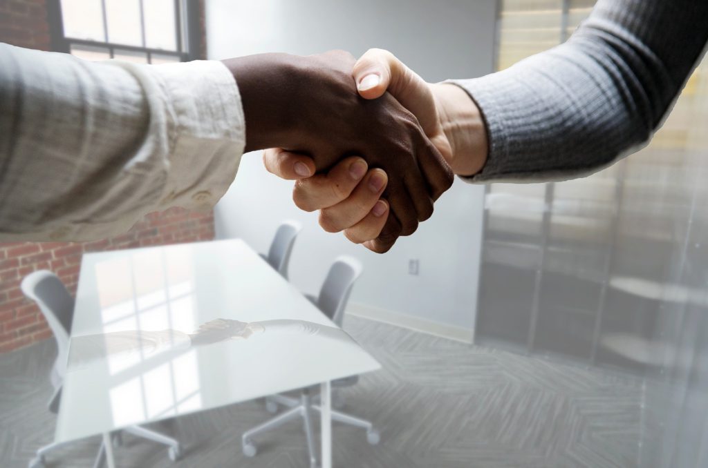 Two persons shaking their hands