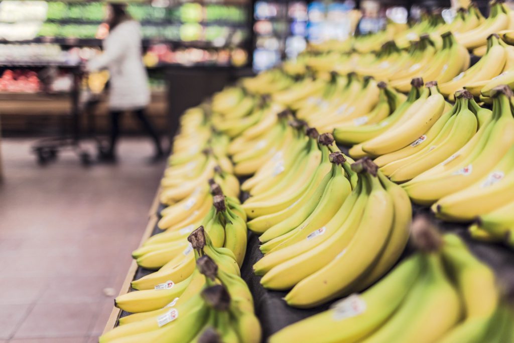 Many bananas in the grocery section of supermarket