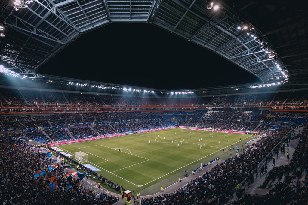 Euro 2020 football games. the stadium is full of people and the game is on.